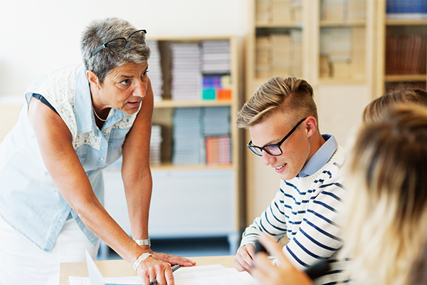 Teacher instructing student