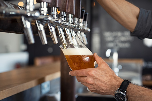 Bar tender pouring beer