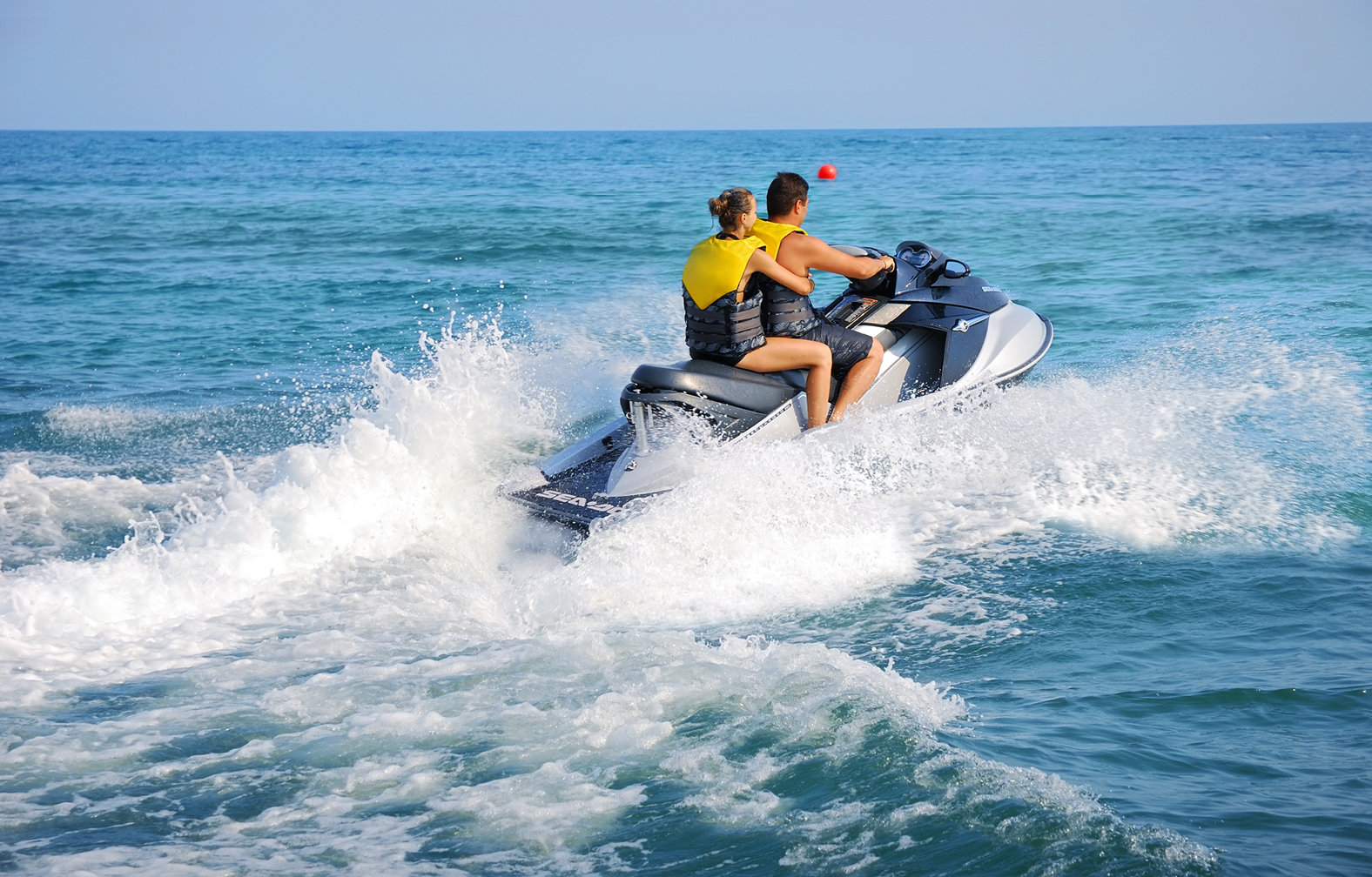 People riding jet ski