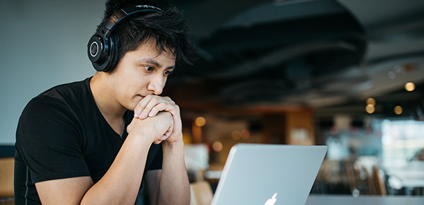 man studying laptop