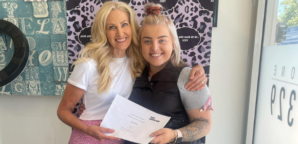 Student with hairdressing teaacher